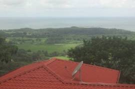 Large undeveloped farm at the base of the World Famous Whale's Tail in Uvita