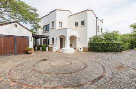 Casa Orquidea: Timeless 6-Bedroom Spanish Colonial in Exclusive Hacienda Pinilla