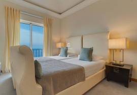 Elegant Two-Bedroom Top-Floor Apartment in Palheiro Village with Panoramic Ocean Views