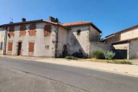 Brillac - Stone house in the village with courtyard, outbuildings, and constructiable land - (business opportunity)