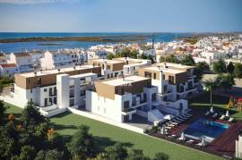Spectacular 2 Bedroom Apartment within Walking Distance to the Ria Formosa and Waterfront of Cabanas.  Amazing Pool and Garage