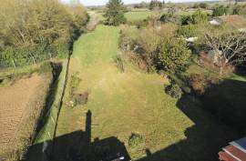 Charming Village Property with Outbuildings and Large Garden - €91395