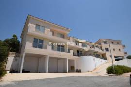 three-bedroom apartment on the first floor for sale in Pegeia, Paphos.