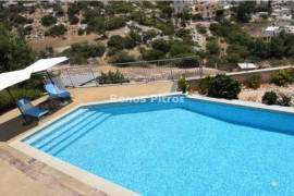 three-bedroom apartment on the first floor for sale in Pegeia, Paphos.