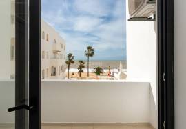 Refurbished 2 bedroom apartment with storage room located on the 1st line of the sea in Quarteira