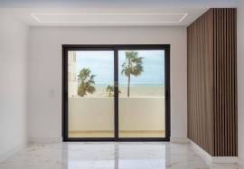 Refurbished 2 bedroom apartment with storage room located on the 1st line of the sea in Quarteira