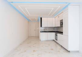 Refurbished 2 bedroom apartment with storage room located on the 1st line of the sea in Quarteira