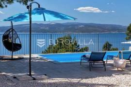 Makarska, a modern villa of rustic Dalmatian charm with a sea view