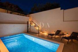 Designer two-story apartment with pool and sea view
