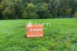 Beau terrain constructible en lisière d'un bois