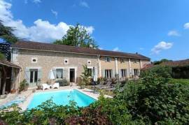 Stone house with guest house and former château outbuildings, featuring garden and swimming pool near Périgueux