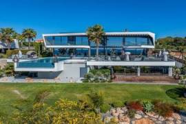 Exclusive modern villa with infinity pool, garage/basement and stunning cliff-front sea views