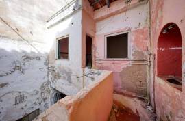 Unique Investment Opportunity in the Heart of Portimão with Rehabilitation Potential