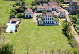 Superb chateau in the Art Deco style with significant outbuildings, guest lodge & pool