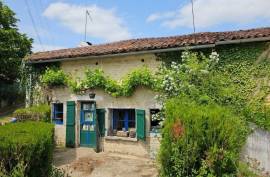 €86000 - Small Picturesque Country House with Outbuildings and Land