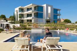 Modern apartment in Monte Rei, overlooking the Atlantic and golf course.