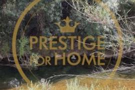 Located near the Roman bridge of Tôr, rustic land 1366 m2, contain a vegetable garden with 3 orange trees and 3 walnut trees, w / hole
