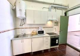 Large garage with mezzanine and bathroom.