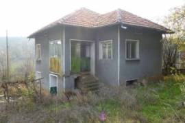 An old rural house with nice plot of land located near forest and hill