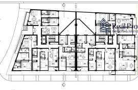 Land with a project of 46 dwellings, in Quarteira. Investment.