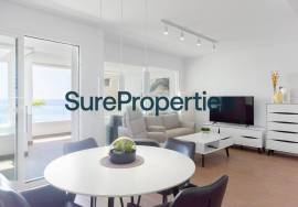 Bright holiday rental apartment with sea views and pool in Torrox Costa.
