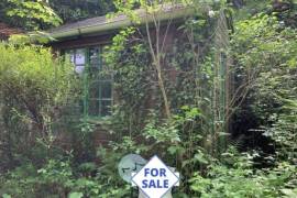 Wooden Chalet on Land Bordered by a River
