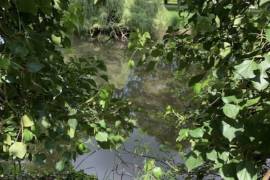 Wooden Chalet on Land Bordered by a River