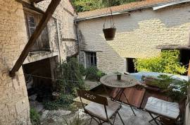 Townhouse in Ruffec with Outbuildings, Garden, and Great Potential - €75,000