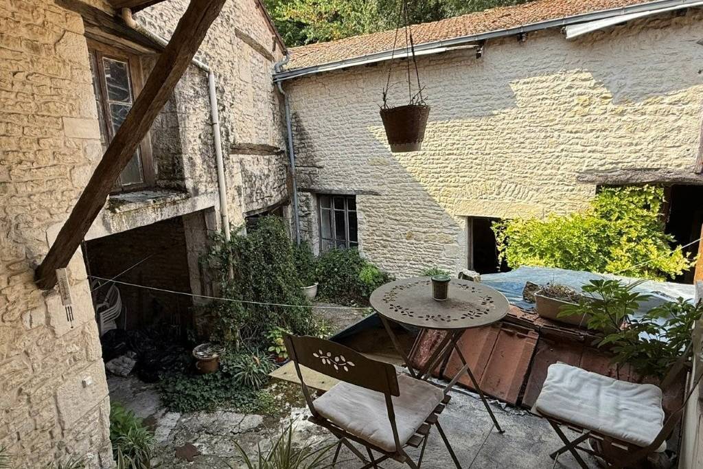 Townhouse in Ruffec with Outbuildings, Garden, and Great Potential - €75,000