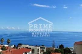 Beautiful top floor apartment with parking included and unobstructed sea views.