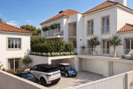Apartamento T2 novo em Alcoitão com terraço, garagem e condomínio fechado.