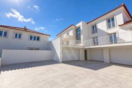 Apartamento T2 novo em Alcoitão com terraço, garagem e condomínio fechado.