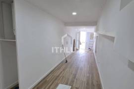 Covered and closed parking transformed into a T0+1 apartment