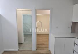 Covered and closed parking transformed into a T0+1 apartment