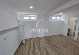 Covered and closed parking transformed into a T0+1 apartment
