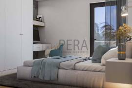 Modern 2 bedroom townhouses under construction on a golf course