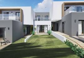 Modern 2 bedroom townhouses under construction on a golf course