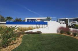 Modern 2 bedroom townhouses under construction on a golf course