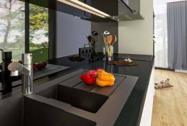 Modern 2 bedroom townhouses under construction on a golf course