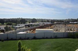 Modern 2 bedroom townhouses under construction on a golf course