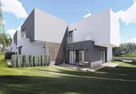 Modern 2 bedroom townhouses under construction on a golf course