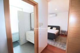 Large 2 bedroom duplex apartment with gym, garage box and swimming pool