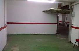 Large closed garage space with storage room and natural light. Large closed garage space with storage room and natural light.