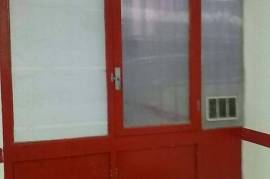 Large closed garage space with storage room and natural light. Large closed garage space with storage room and natural light.