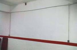 Large closed garage space with storage room and natural light. Large closed garage space with storage room and natural light.