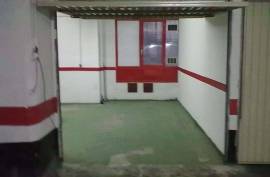 Large closed garage space with storage room and natural light. Large closed garage space with storage room and natural light.