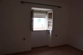 Semi-detached single storey house with backyard 