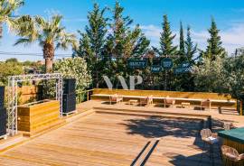 Outdoor Restaurant with Wooden Deck and Surrounding Tropical Setting, Almancil