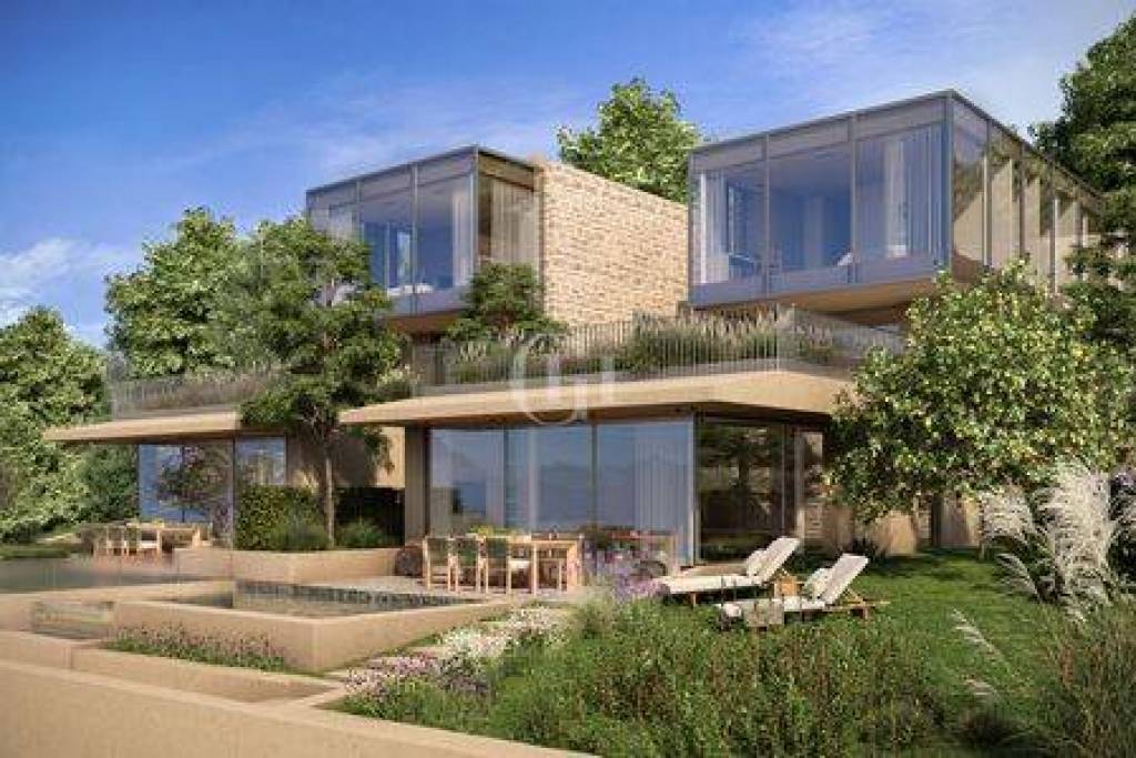 Luxury lakefront apartment with terrace, pool and garden