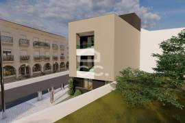 Land with approved project for a building with 3 apartments in the center of Avelar.